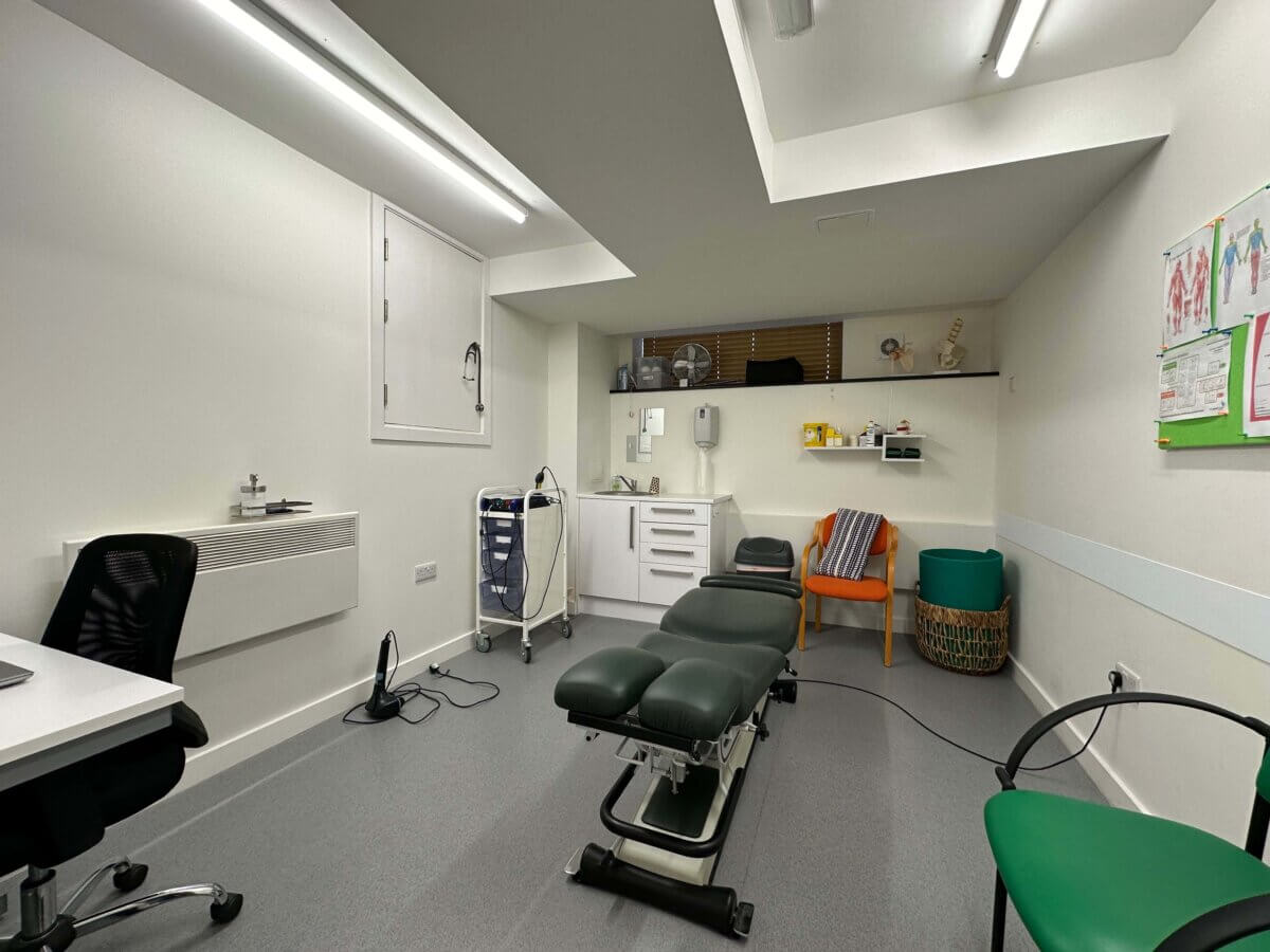 Clinic Room with chiropractor chair in middle of room